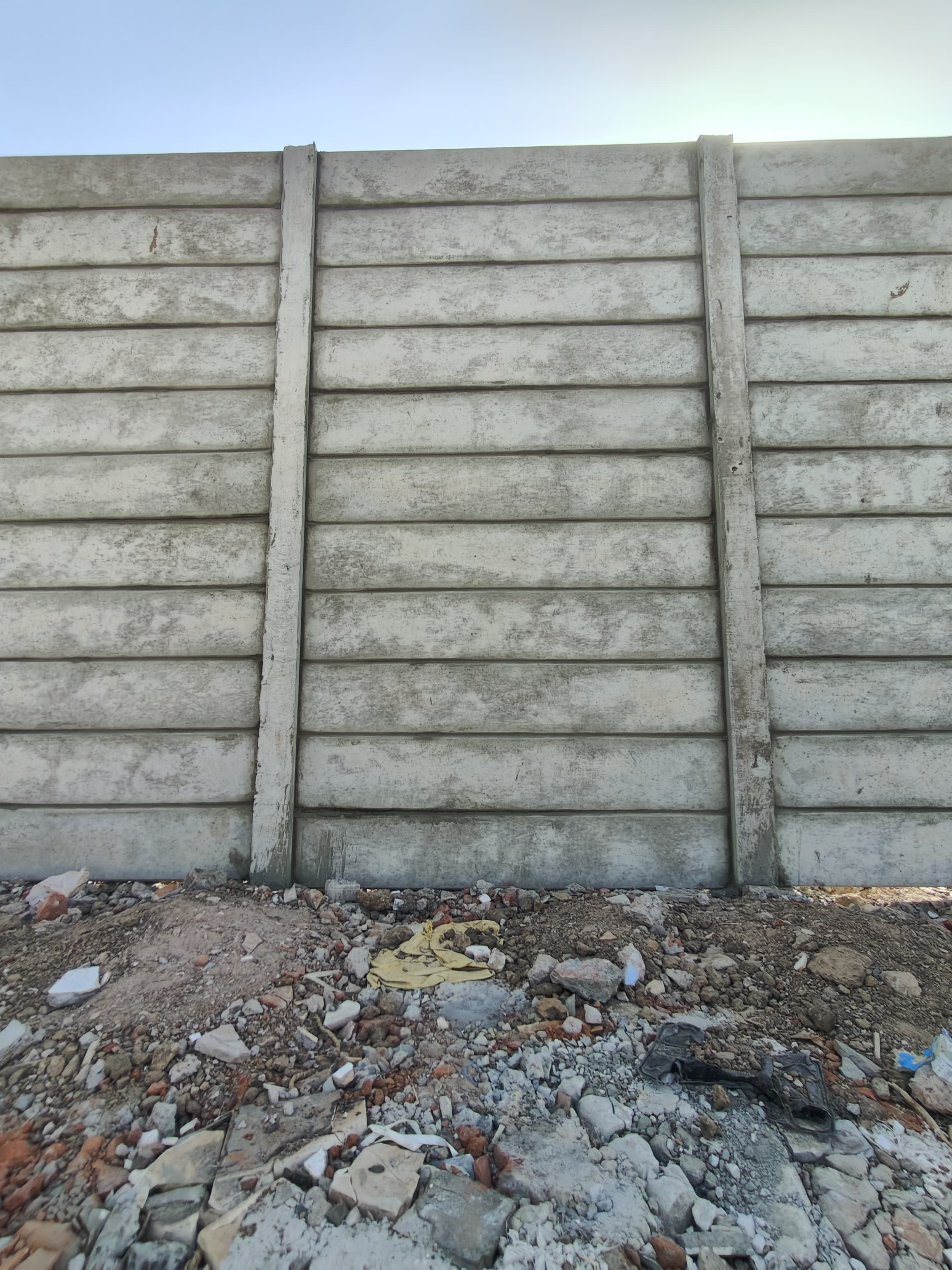 Precast boundary wall panels at Odhav industrial plot, straight section